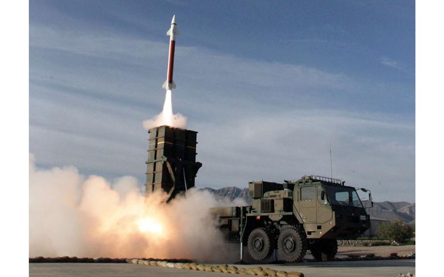 Members of the Japan Ground Self-Defense Force fire a Type-03 missile in this undated photo.