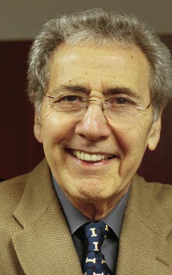 A portrait of a smiling man.
