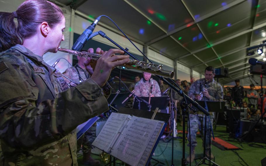 Academy Winds from the U.S. Air Force Academy, performs at Aman Omid Village for Afghan evacuees to provide musical entertainment at Holloman Air Force Base, N.M., Oct. 13, 2021. 