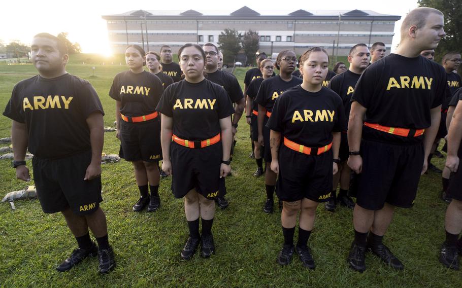 Students in the new Army prep course stand at attention after physical training exercises at Fort Jackson in Columbia, S.C., Aug. 27, 2022. 