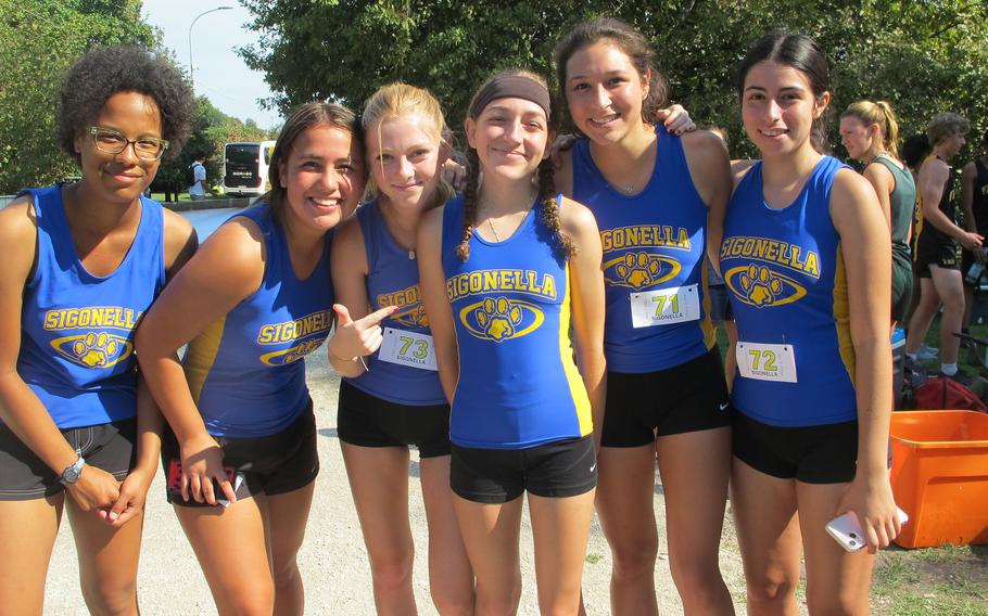 Girls from Sigonella flank the girls’ second-place finisher, Kayly Eimicke, after the first cross country event of the season. From left: Aletta Berry, Leila Denton, Molly Lefringhouse, Eimicke, Matea Torres and Keila Fuentes.