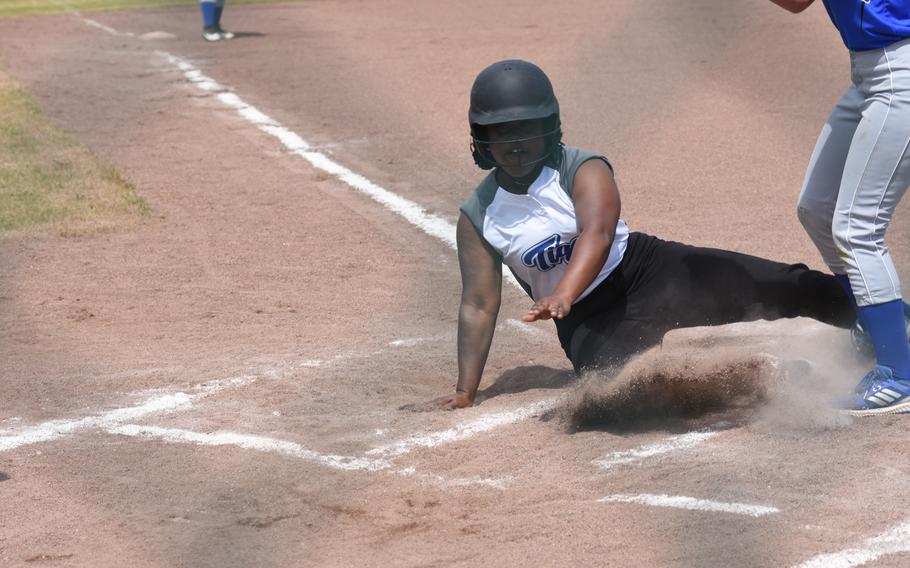 Hohenfels’ Kennedy Liverpool slides into home base during a first-round game against Rota in the DODEA-Europe softball tournament on Thursday, May 19, 2022, at Kaiserslautern High School, Germany. Rota went on to win, 17-10.