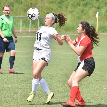 Naples' Emma Kasparek tries to control the ball to set up a shot against American Overseas School of Rome on Tuesday, May 17, 2022, at the DODEA-Europe girls Division II soccer championships at Landstuhl, Germany.