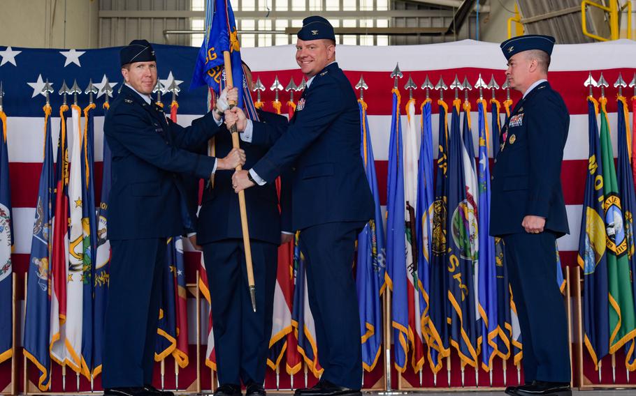 Col. Gregory Mayer, center, accepts the command guidon of the 5th Mission Support Group on June 30, 2022, at Minot Air Force Base, N.D. Mayer is one of two commanders at the base who were recently relieved.