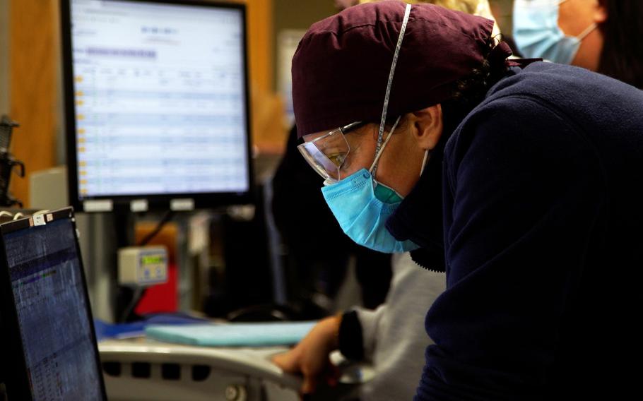 Laura Forman, director of Kent Hospital’s emergency department, checks patient details. 