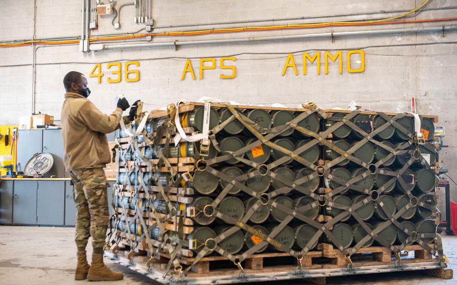 Airmen and civilians from the 436th Aerial Port Squadron palletize ammunition, weapons and other equipment bound for Ukraine during a foreign military sales mission at Dover Air Force Base, Delaware, Jan. 21, 2022. 