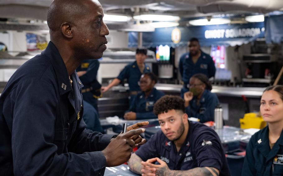 Chaplain (Lt.) Daniel Lubega, 47, speaks about resiliency to sailors aboard the the guided-missile destroyer USS Milius while underway in the Philippine Sea, Sept. 27, 2022.