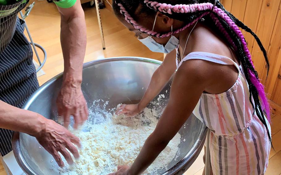 Mixing udon noodle dough at Komatsuzawa Leisure Farm in Saitama prefecture, Japan, July 24, 2022.