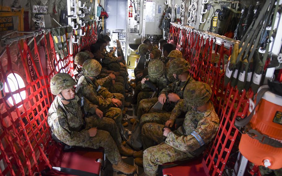Japan Ground Self-Defense Force soldiers prepare for takeoff on a U.S. C-130J Super Hercules during a Valiant Shield exercise at Yokota Air Base, Japan, on Saturday, June 15, 2024. 