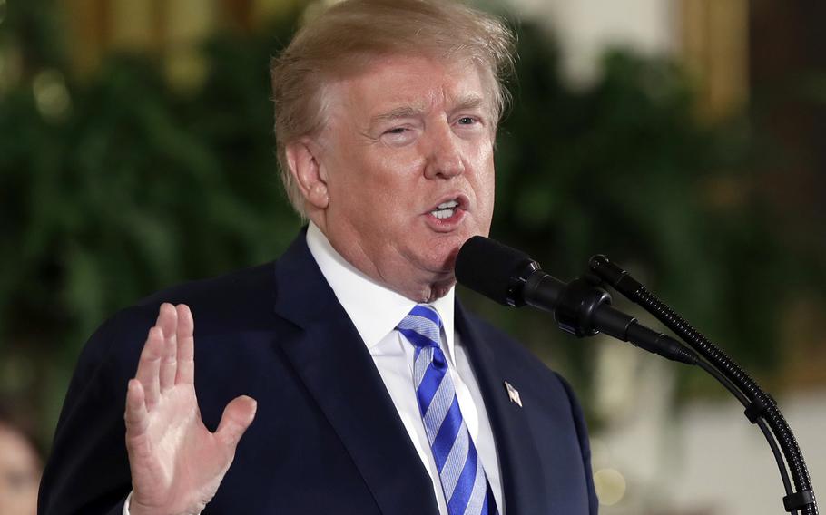 President Donald Trump speaks in the East Room of the White House in Washington on Feb. 20, 2018. Trump's White House has failed to report more than 100 gifts from foreign nations worth more than a quarter-million dollars, and federal officials have been unable to find a life-size painting of Trump given by the president of El Salvador as well as golf clubs from the prime minister of Japan, according to a report Friday from House Democrats.