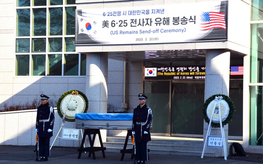 Troops watch over a casket holding the remains of a U.S. service member killed during the Korean War during a repatriation ceremony at Seoul National Cemetery, Wednesday, Feb. 22, 2023. 