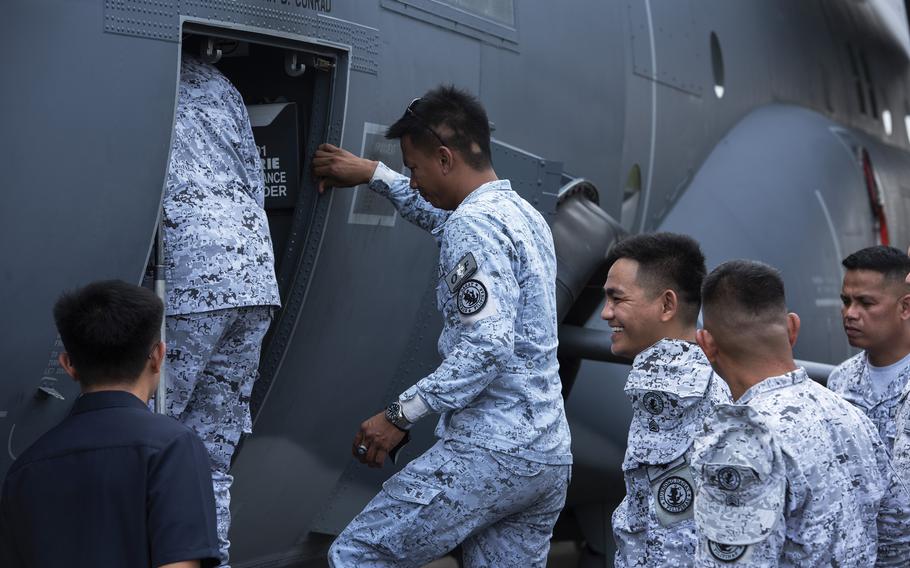 Philippine navy sailors check out an Air Force AC-130J Ghostrider gunship at the former home of Naval Air Station Cubi Point, Philippines, April 23, 2023.