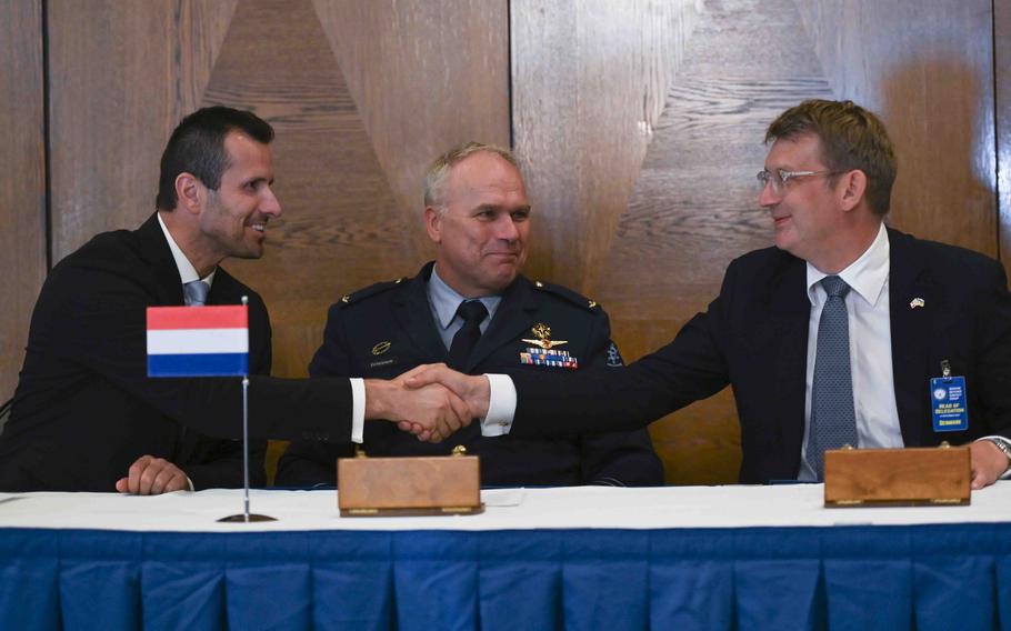 From left, Daniel Blažkovec, the deputy minister of defense of the Czech Republic; Gen. Onno Eichelsheim, the Dutch chief of defense; and Troels Lund Poulsen, the Danish defense minister, sign a trilateral defense cooperation agreement during the Ukraine Defense Contact Group meeting Sept. 19, 2023, at Ramstein Air Base in Germany.