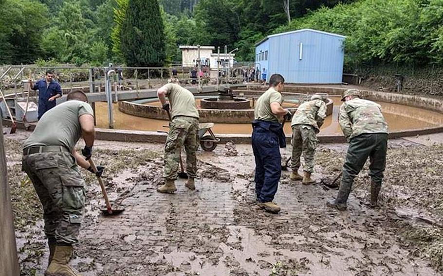 Volunteers from Spangdahlem Air Base, Germany, help clear mud on Saturday, July 17, 2021, in Irrel. The village, located about 21 miles southwest of Spangdahlem, is near the border with Luxembourg at the confluence of the Pruem and Nims rivers. The area received heavy damage during the torrential rainfall last week that caused deadly flash floods across parts of western Germany and Belgium.