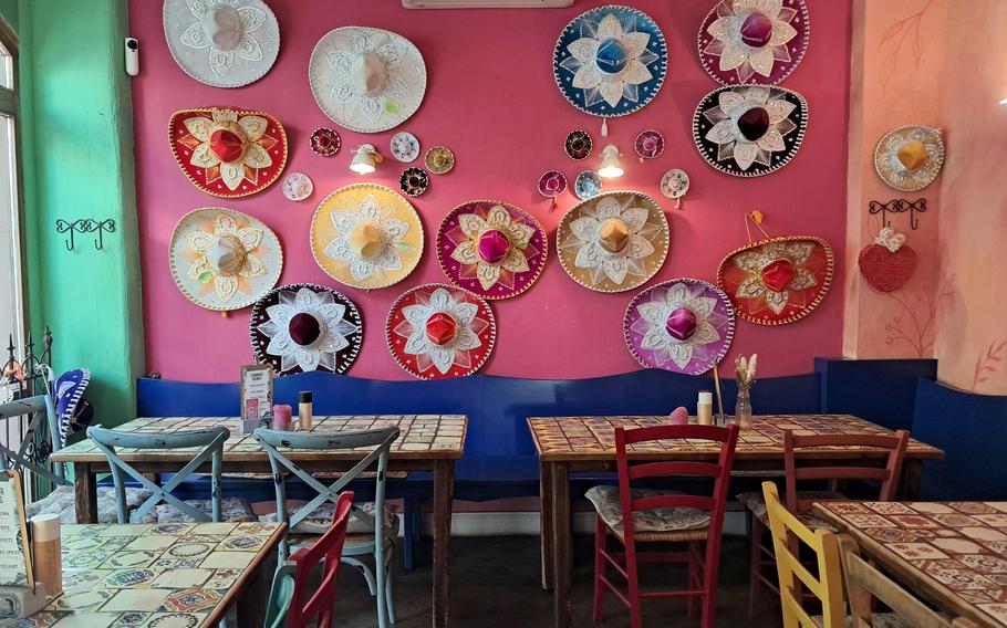 Sombreros decorate a wall at a Mexican restaurant.