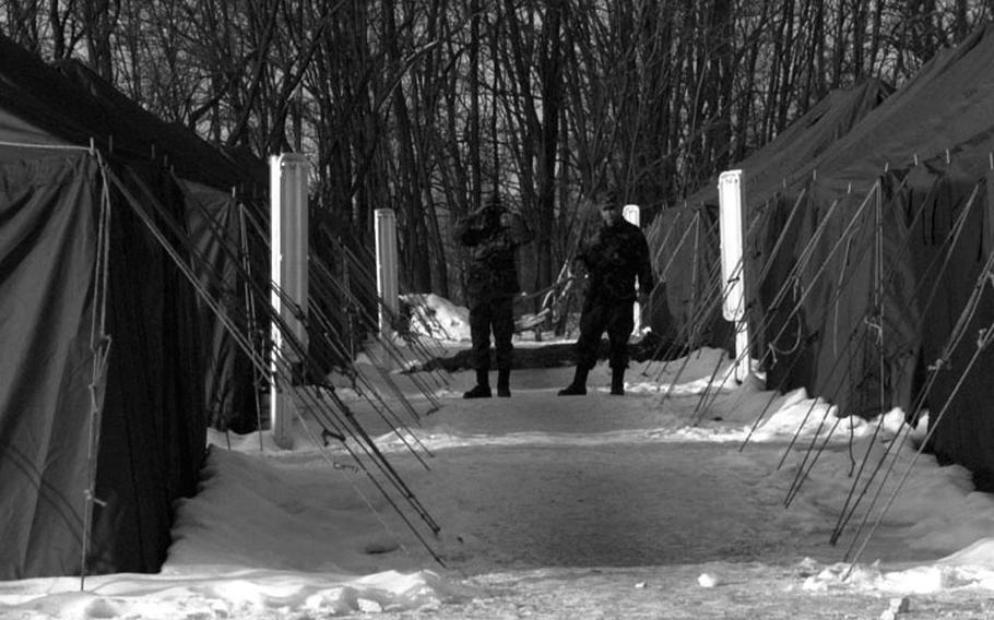 Taszar AB, Hungary, January, 1996: Snow and bitter cold were the companions for soldiers passing through Taszar's tent city on their way to Bosnia.