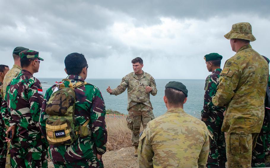 U.S. Army Lt. Jared McCully holds a discussion with Indonesian and Australian troops outside the Flagstaff Hill Cafe in Bowen, Australia, Thursday, July 27, 2023.
