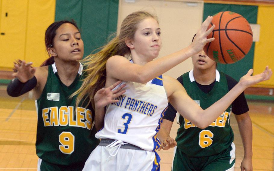 Yokota's Charlotte Rhyne spent part of last summer at a PGC Camp; Maliyah Magat, left, is one of two Magat siblings playing basketball for Robert D. Edgren.