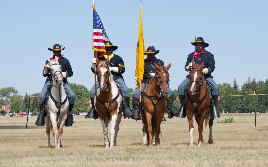 Buffalo Soldier re-enactors ride horses July 24, 2016, during Fort D.A. Russell Days, the annual F.E. Warren Air Force Base, Wyo., open house.