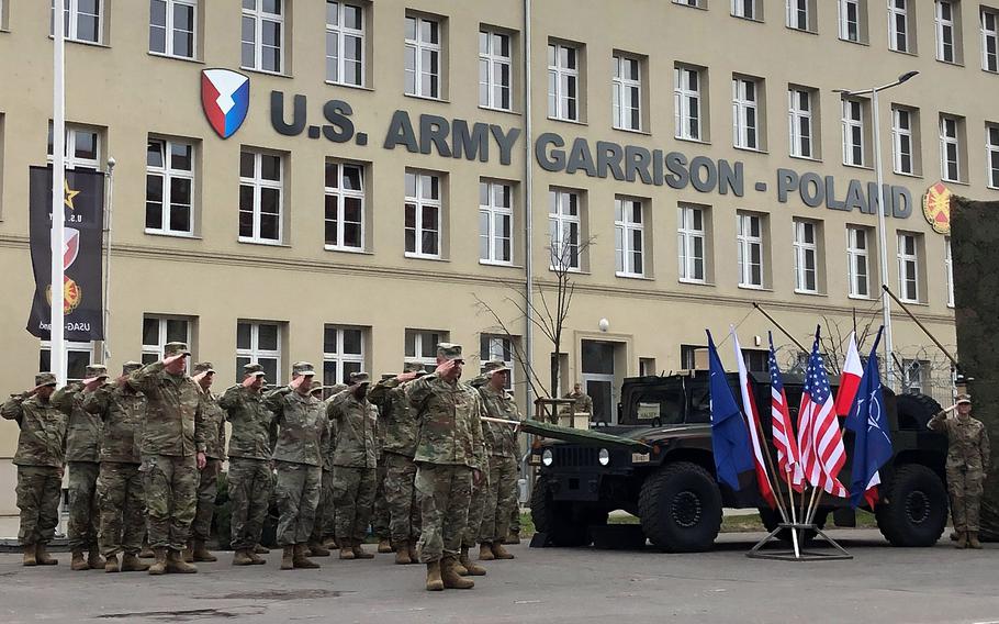 Soldiers stand at attention March 21, 2023, during the activation of the new U.S. Army garrison in Poland, headquartered in the city of Poznan.