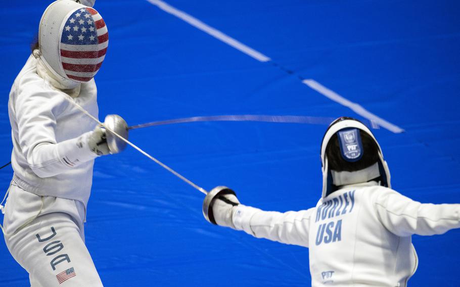 A U.S. women’s Olympic fencing team cadet athlete, Amanda Pirkowski, left, spars with Olympian Kelley Hurley inside Lotus Culture Center Arena at the Atago Sports Complex in Iwakuni, Japan, July 16, 2021. 