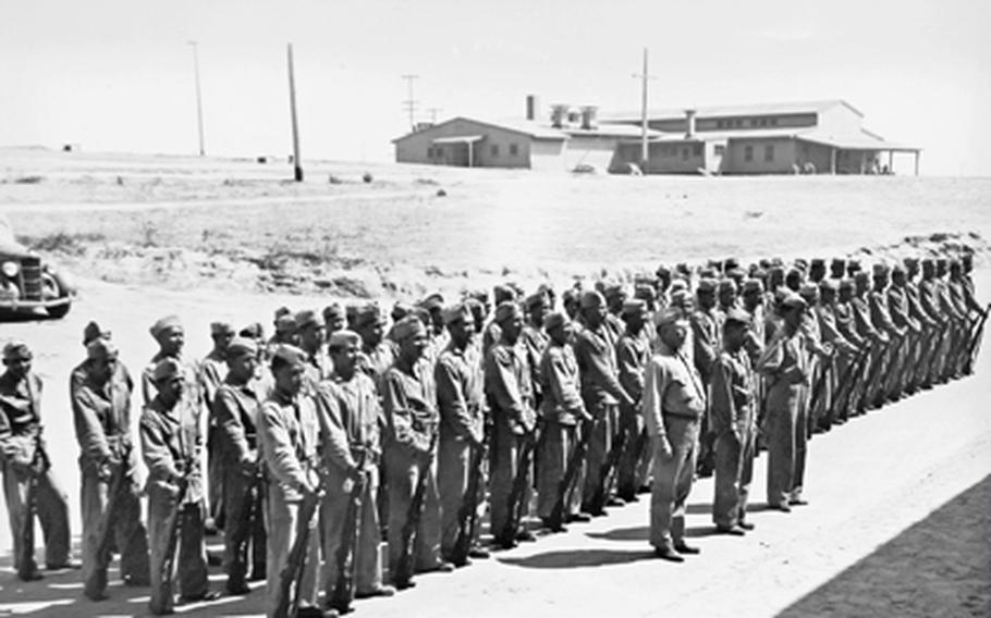 A platoon of Navajo Code Talkers stand in formation at Camp Elliot, Calif., under the supervision of Staff Sgt. Philip Johnston. The Navajo created the first version of the their code at Camp Elliot.