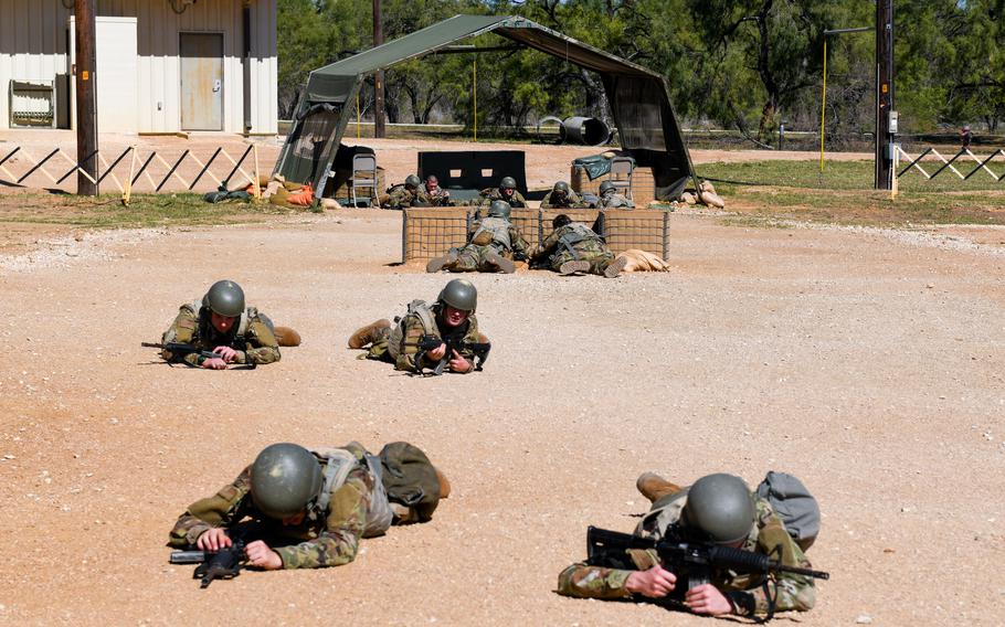 Air Force trainees take cover from a simulated attack at Joint Base San Antonio-Chapman Training Annex, Texas, Oct. 26, 2022. The airmen participated in PACER FORGE, a new 36-hour, scenario-based exercise that tests trainees’ teamwork, discipline, and problem-solving skills before graduating basic military training.