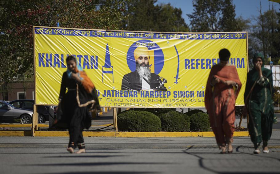 A photograph of late temple president Hardeep Singh Nijjar is seen on a banner outside the Guru Nanak Sikh Gurdwara Sahib in Surrey, British Columbia, on Monday, Sept. 18, 2023, where temple president Hardeep Singh Nijjar was gunned down in his vehicle while leaving the temple parking lot in June. Canada expelled a top Indian diplomat Monday as it investigates what Prime Minister Justin Trudeau called credible allegations that India’s government may have had links to the assassination in Canada of a Sikh activist.