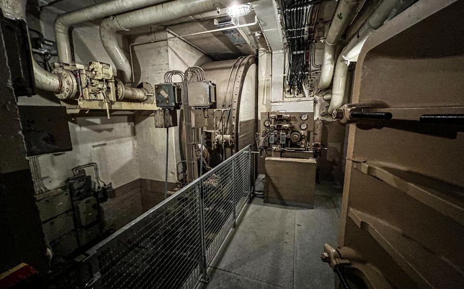 A room within the former German government bunker houses the door closure mechanism for the 25-ton round nuclear blast doors  in Bad Neuenahr-Ahrweiler, Germany, Feb. 13, 2022. Two doors made up the entrance to the bunker's airlock entranceway and took several minutes to open and close.