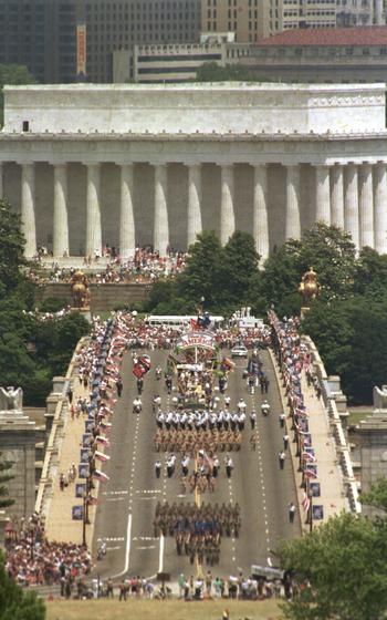 Troops march across the bridge.