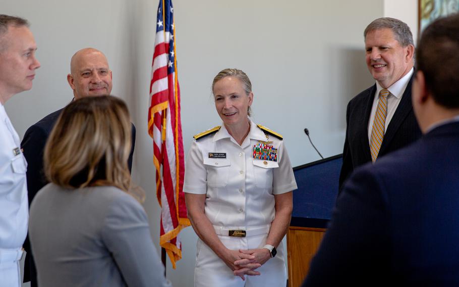 Historian Timothy Francis, then-Rear Adm. Sara Joyner (middle), and then-Assistant Navy Secretary James Geurts (right) speak with guests after the ceremony commemorating the anniversary of the Battle of Midway at the Dirksen Senate Office Building in Washington, DC., in May 2021.