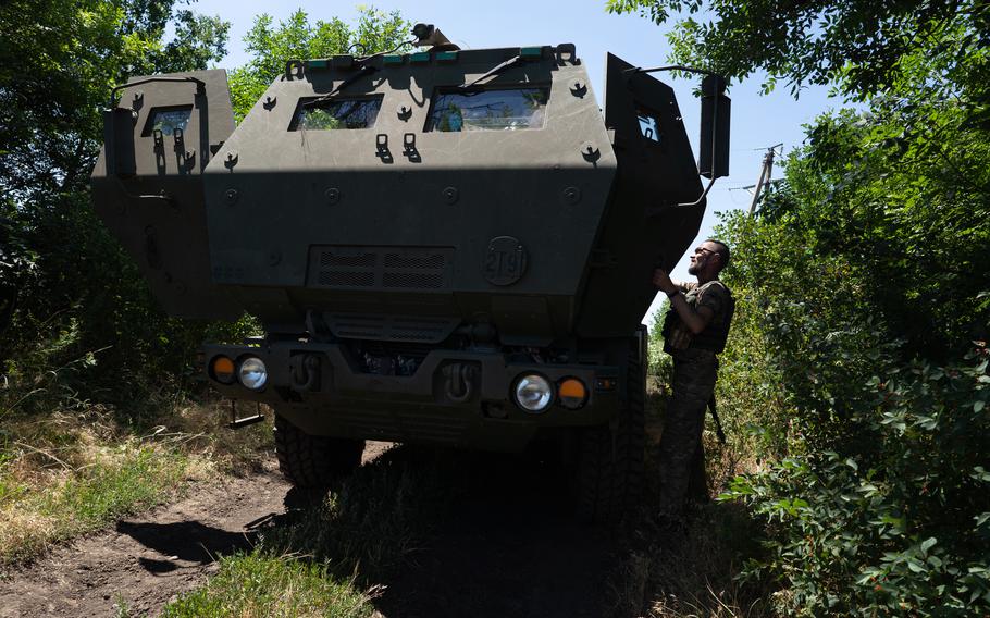A Ukrainian serviceman opens the door to a HIMARS vehicle in Eastern Ukraine on July 1, 2022. 