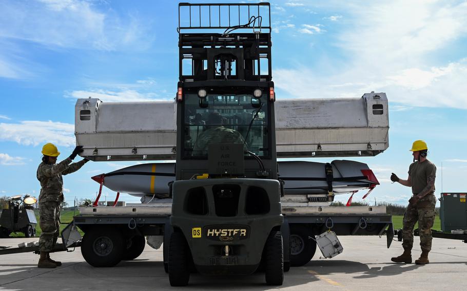 U.S. airmen with the 5th Munitions Squadron load a joint air-to-surface standoff missile at Minot Air Force Base, N.D., Oct. 4, 2023. The State Department this week approved the sale of over 800 extended-range JASSMs to Poland for about $1.8 billion.