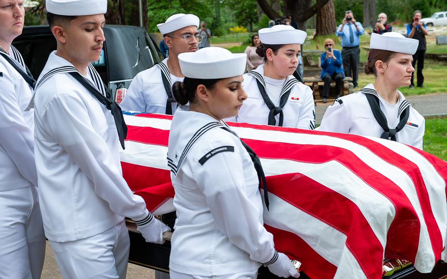Navy Reserve Center Sacramento funeral honor detail sailors carry the casket of retired Lt. Cmdr. Lou Conter during his memorial service.