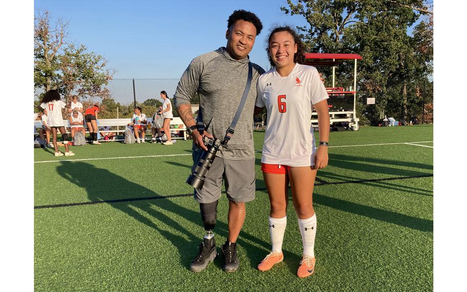 Jae Terry, left, is a wounded warrior who enjoys taking photos during each of his daughter Lexi’s soccer games. Lexi is a junior center back for the top-ranked McDonogh Eagles. 