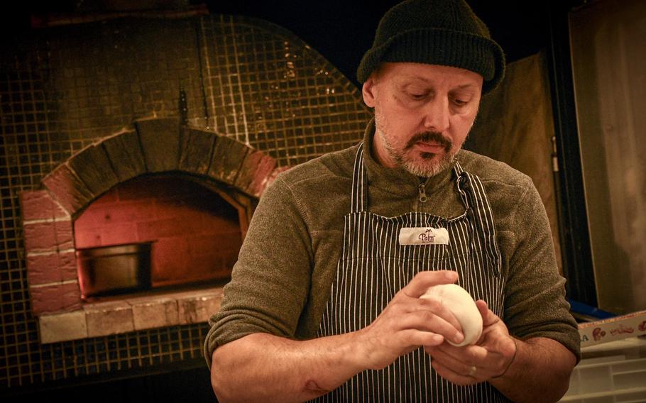 Sinan Jahic tucks in the bottom of a dough ball so the gases produced by the yeast cannot escape. Instead, they provide airiness to the crust of his pizzas.