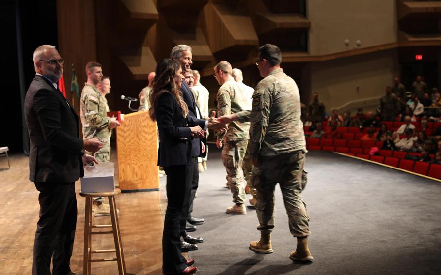 Gov. Kristi Noem greets members of South Dakota National Guard’s 235th Military Police Company on Sunday, Nov. 13, 2022, during a welcome home ceremony at The Monument’s Fine Arts Theater in Rapid City.