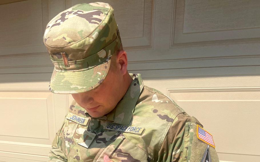 Space Force 2nd Lt. Tanner Johnson shows the continuous glucose monitor he wears on his abdomen to monitor his blood sugar. Johnson commissioned into the Space Force at a ceremony at the U.S. Air Force Academy on May 25, 2021, becoming the first person diagnosed with Type 1 diabetes to be allowed to join the U.S. military.