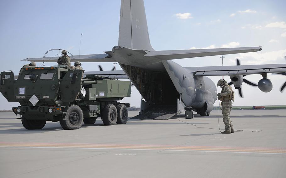 Soldiers from 41st Field Artillery Brigade offload a High Mobility Artillery Rocket System from an Air Force C-130 aircraft at Mihail Kogalinceanu, Romania, in April 2021. A Pentagon strategy that emphasizes unpredictable short-term deployments is more likely to risk escalation with Russia than a forward-based military presence, a Rand Corp. study found.