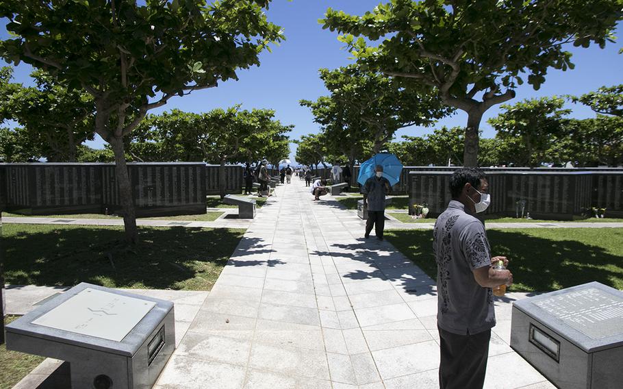 Visitors viewed the Cornerstone of Peace memorial during the Irei no Hi ceremony at Peace Memorial Park in Okinawa, Japan, on June 23, 2022. 