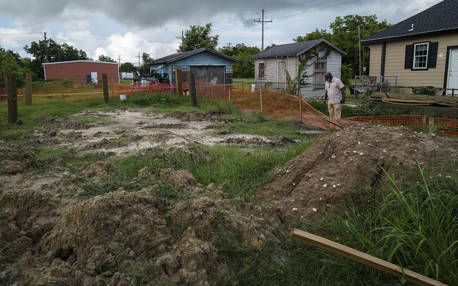 Hilton Kelley, an environmental and community activist, looks at the site where a substance believed to be oil was discovered during construction of a house. 