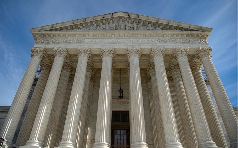 The U.S. Supreme Court building as viewed from its front and base.