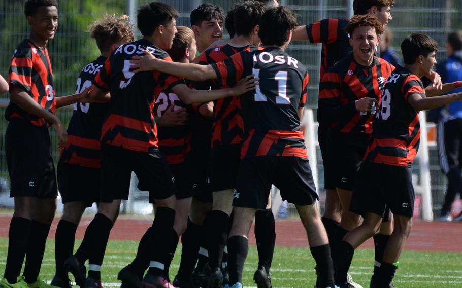 American Overseas School of Rome players celebrate their 5-1 victory over the Naples Wildcats in the boys Division II final at the DODEA-Europe soccer championships in Ramstein, Germany, May 18, 2023. 