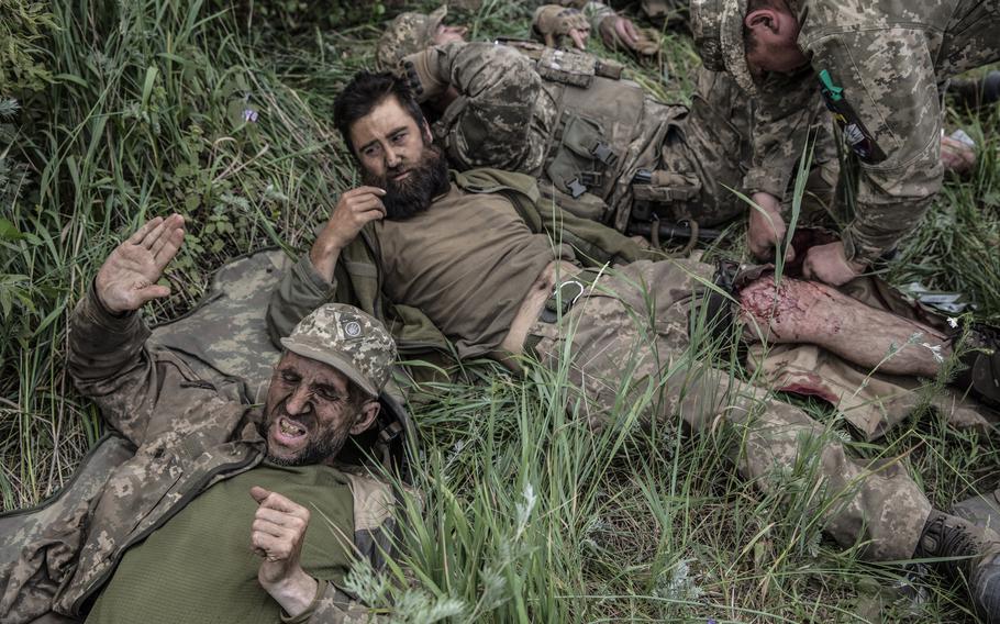 Wounded soldiers of the Ukrainian Airborne unit are treated outside the embattled city of Lysychansk, Ukraine on June 26, 2022. 