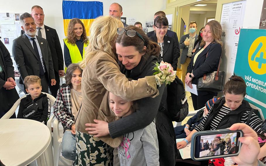 First lady Jill Biden hugs Victoria Kutocha and her 7-year-old daughter, Yulie, while meeting with displaced Ukrainian families at a refugee center in Kosice, Slovakia, on May 8. 