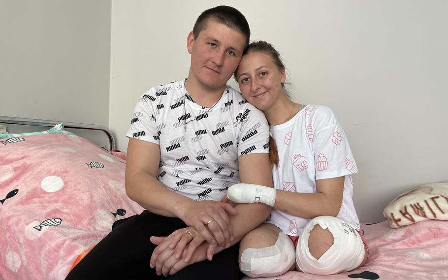 Oksana Balandina), who lost both legs to a mine, danced with her new husband, Viktor Vasyliv, at their hospital wedding in Lviv, in western Ukraine. 