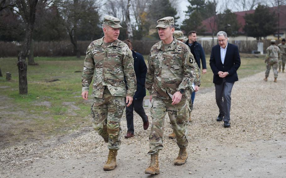 Maj. Gen. JP McGee, commander of the 101st Airborne Division, and Army Chief of Staff Gen. James McConville held talks on the security situation in Ukraine and the division's deployment to Romania during McConville's visit to Mihail Kogalniceanu Air Base in Romania on Dec. 16, 2022. 