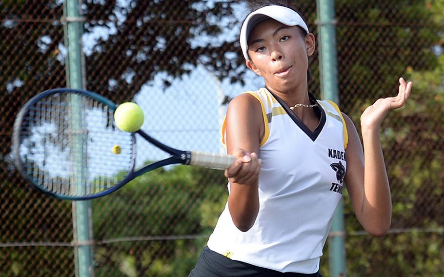 Kadena's Christine Ryan hits a forehand return against Kubasaki's Ella Perez during Thursday's Okinawa tennis matches. Ryan won 8-2.