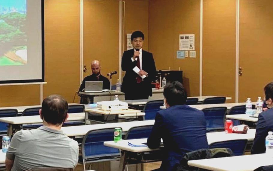 Narushige Michishita of the National Graduate Institute for Policy Studies in Tokyo speaks at a seminar presented by the Yokosuka Council on Asia-Pacific Studies at Sasebo Naval Base, Japan, on Nov. 11, 2021. 
 