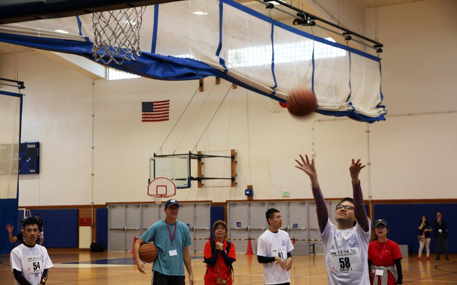 A player participates in the basketball skills competition during the Kadena Special Olympics at Kadena Air Base, Okinawa, Dec. 9, 2023.